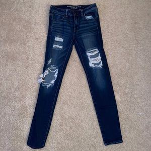 Dark blue distressed AE jeans